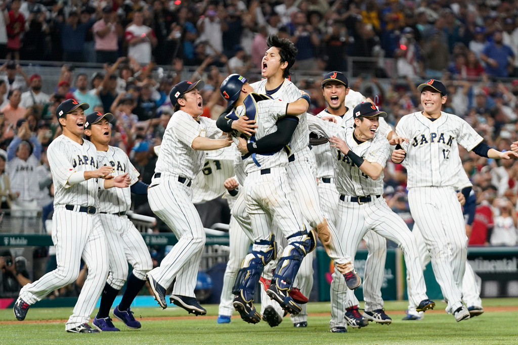 Japan pitcher Shohei Ohtani, center, celebrates with teammates after defeating the United States in the championship game of the World Baseball Classic.