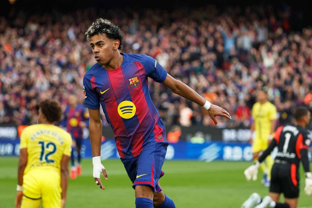 Barcelona's Lamine Yamal celebrates scoring his side's opening goal in a soccer match.