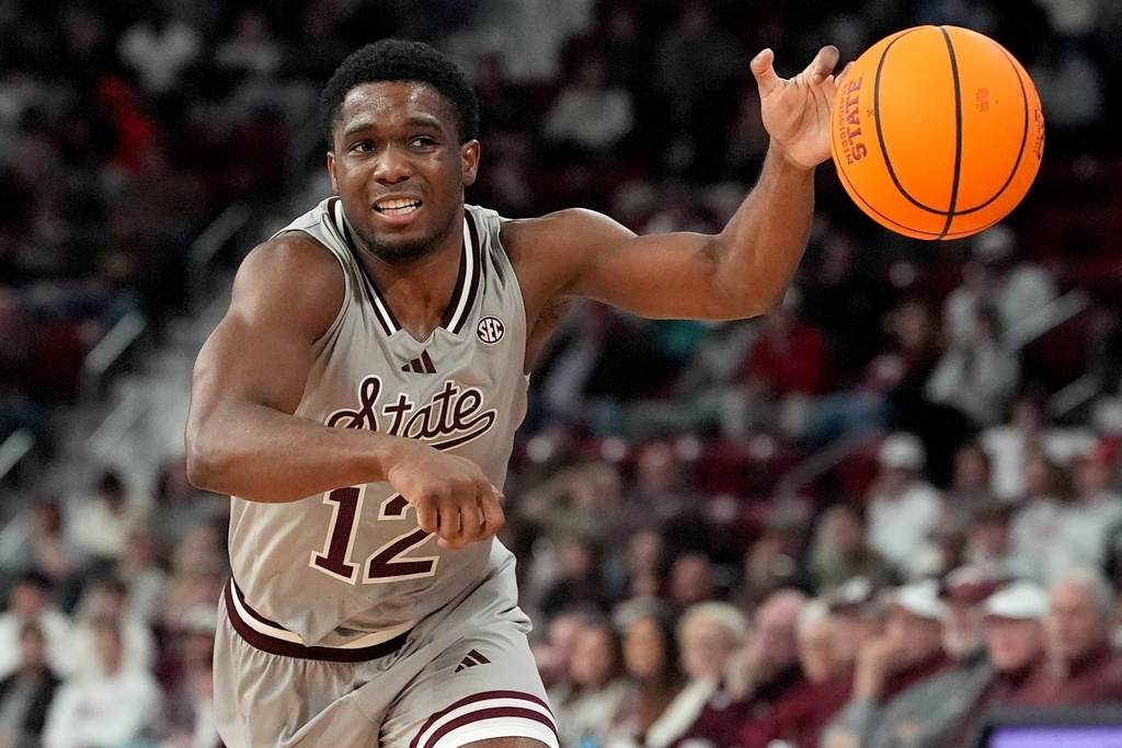 Mississippi State Bulldogs G Josh Hubbard goes for a loose ball against the Alabama Crimson Tide.