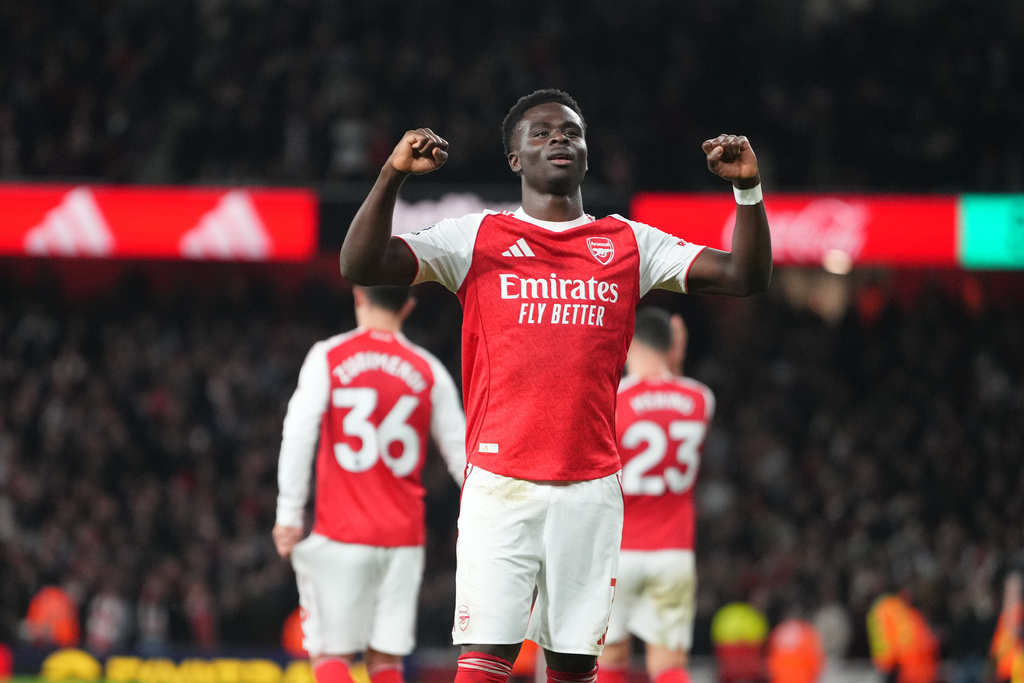 Arsenal's Bukayo Saka celebrates after scoring during a Premier League soccer match