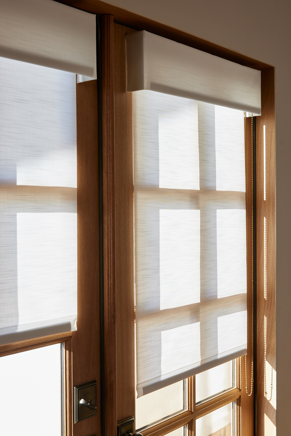 drop down  rolling shades on a door