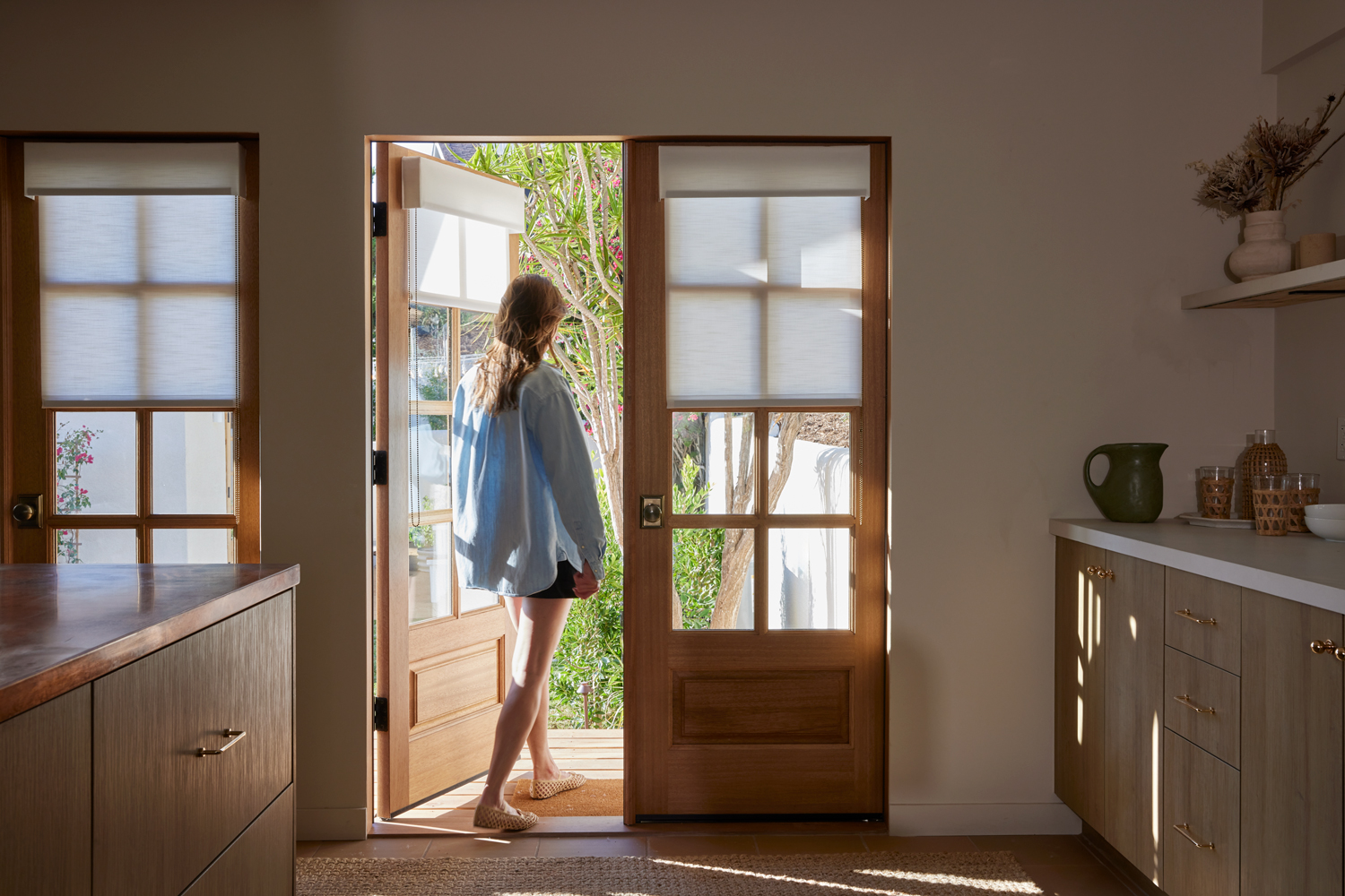 Kitchen with drop down shades on doors