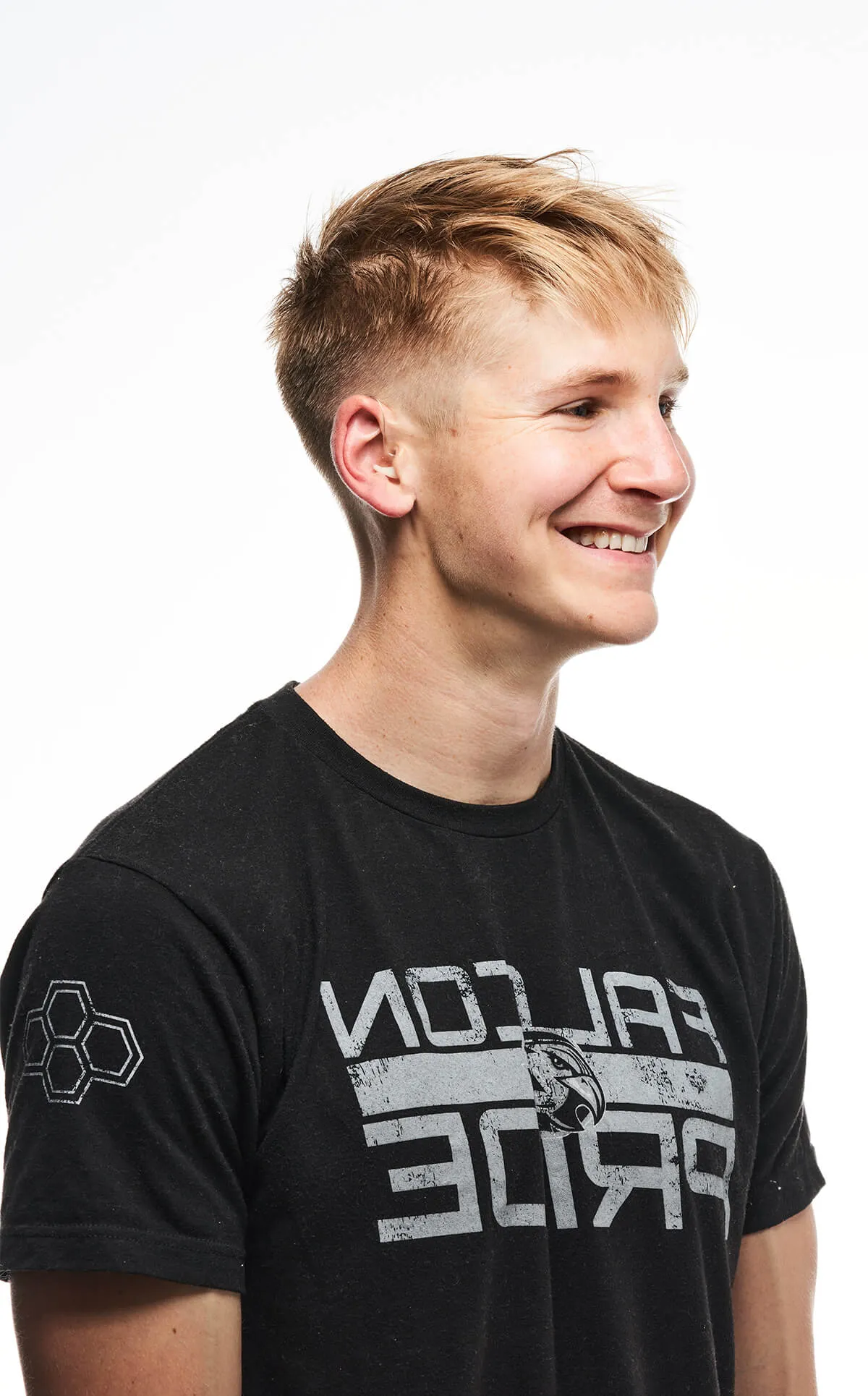 A man wearing a black shirt with the words "Fuck You" on it.