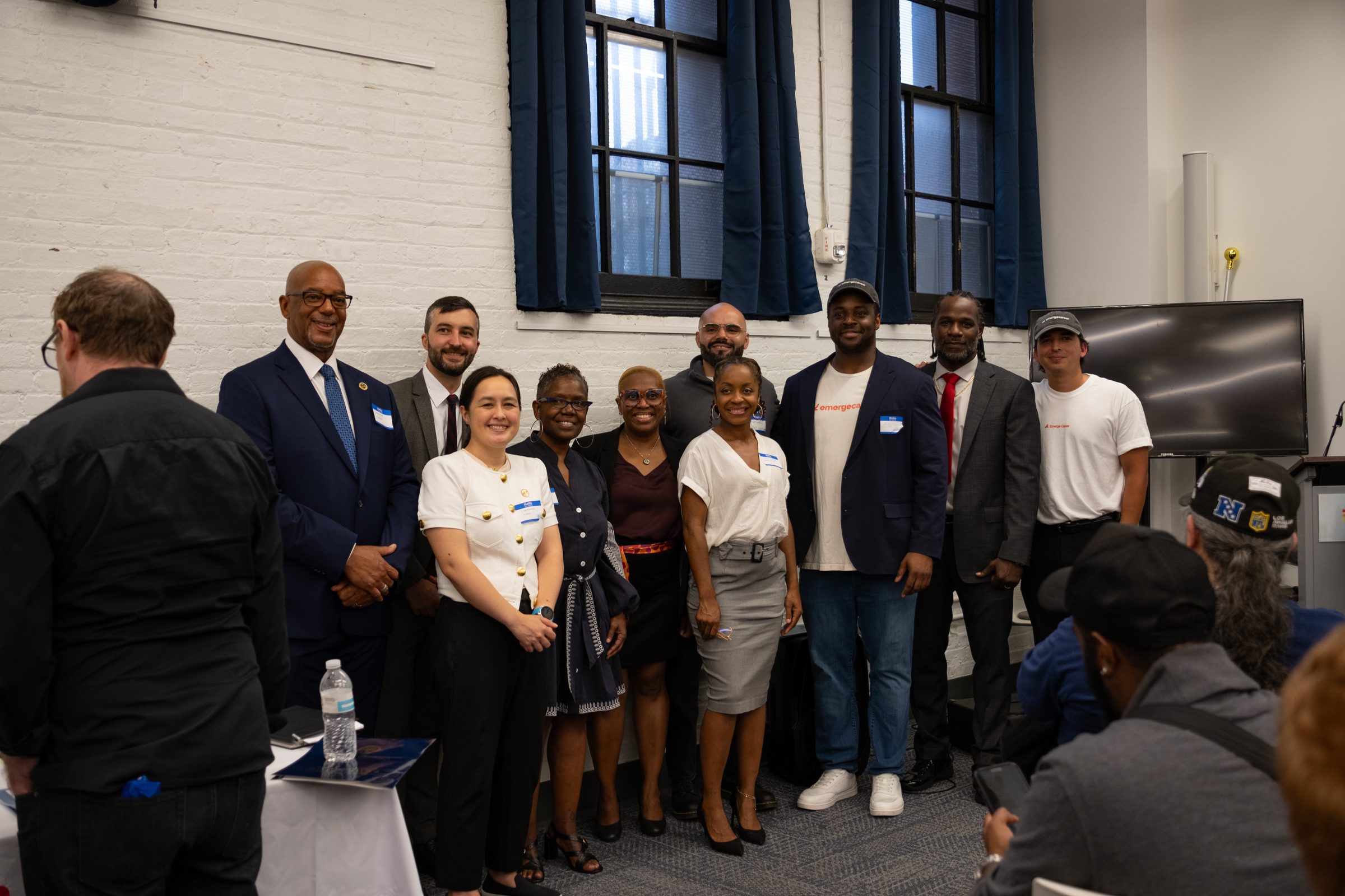 Emerge Career graduates, staff, and New York City agency commissioners at the Next Mile NYC Economic Opportunity Summit in Brooklyn.