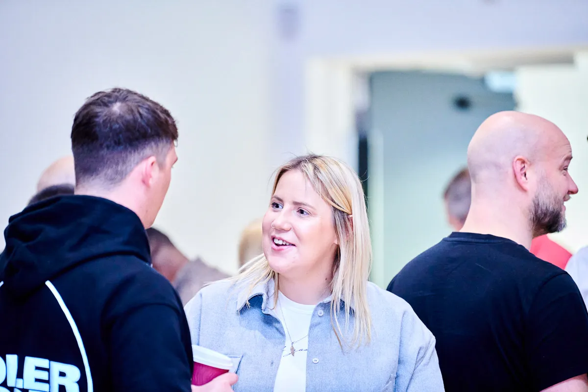 Colleagues deep in discussion, exchanging ideas and insights with focused intensity.