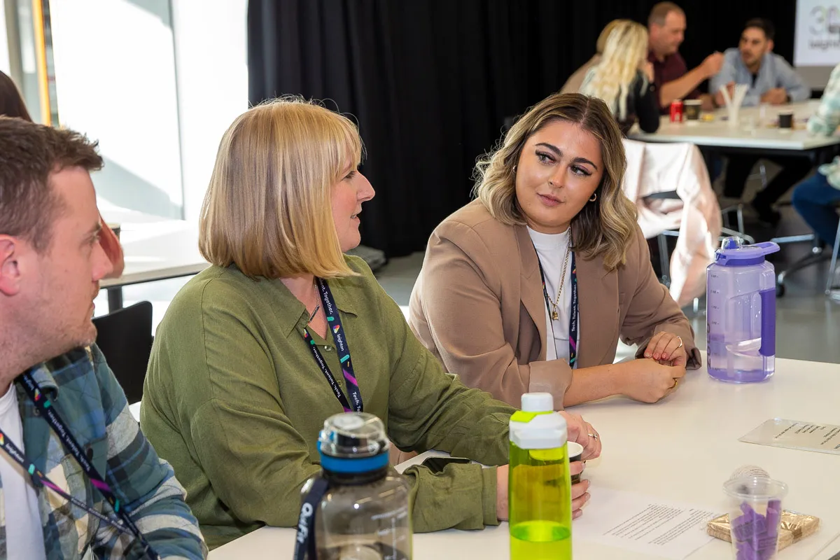 A focused view on Natasha, our finance apprentice, as she takes part in team discussion.