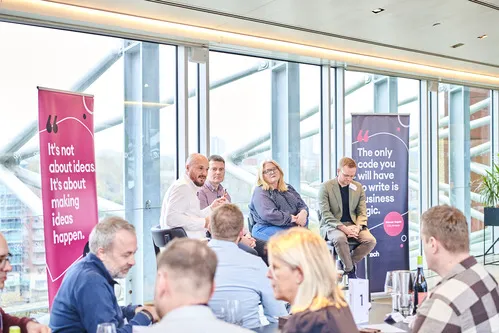 The on:tech panel sat side by side on stage taking questions from the audience. 