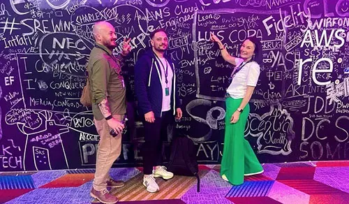 Steve Morland CTO, Lee Gilmore AWS Practice Lead and Claire Cundill CBO (L-R) pose for a photo at re:Invent. 