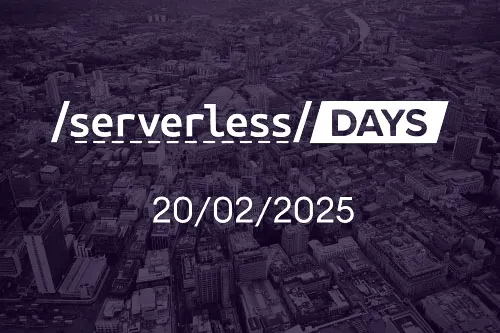 A vibrant image of Manchester, overlaid with ServerlessDays logo and the date of the event. 