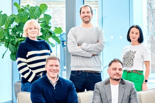 Leighton colleagues posing together: L-R- Claire Gledhill COO, Andy Carr CFO, James Bunting CEO, Lee Gilmore AWS Practice Lead and Claire Cundill CBO.