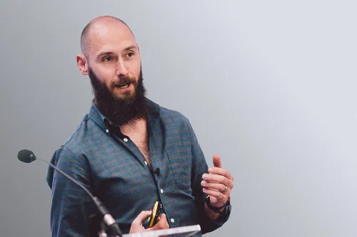 Tom Preval stood up delivering a presentation