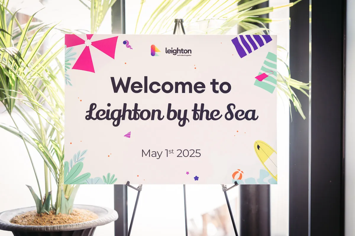 A Leighton-branded board, with a welcoming message for colleagues and the date of the event.