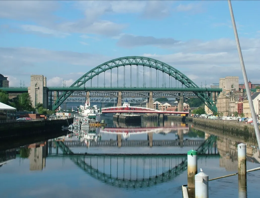 A photograph of the Tyne bridge, reflecting on to the River Tyne.