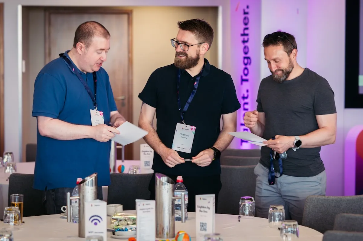 An image of the Great Place to Work badge, with an individual sat with headphone, with "We're a UK's Best Workplace in Tech" and the year 2025 written in the centre of the graphic.
