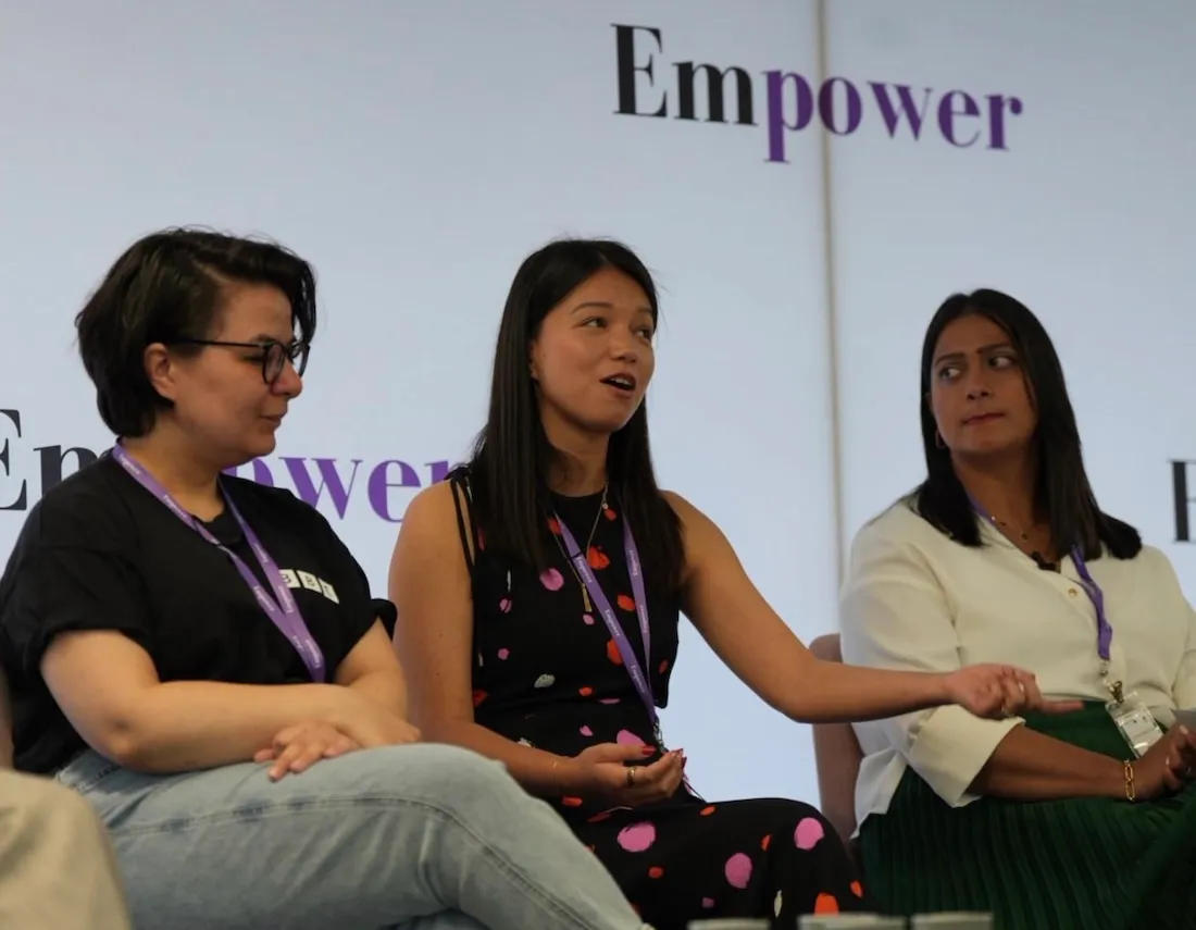 Jo Larby in centre, along with two panelists in conversation.