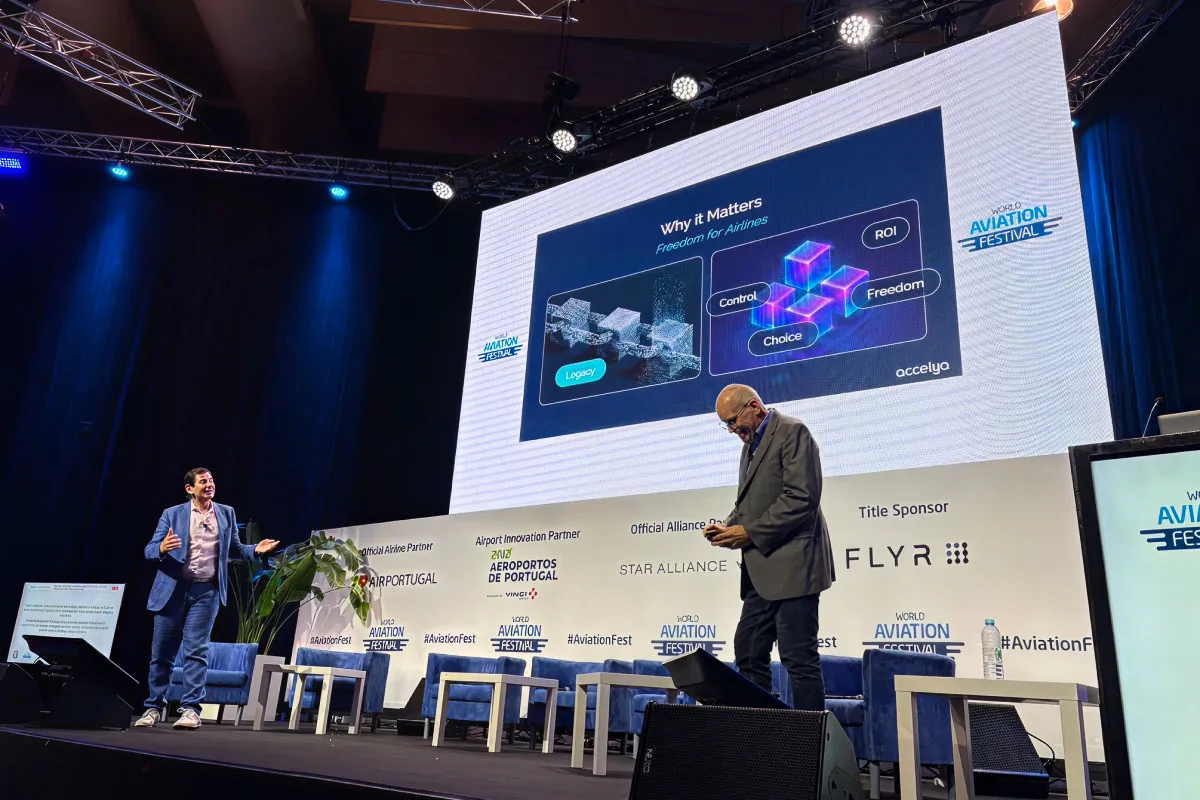 Two speakers on stage during the World Aviation Festival.