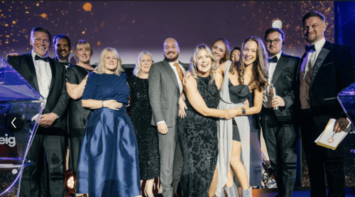 Leighton colleagues, on stage collecting the award for Outstanding Workplace. 