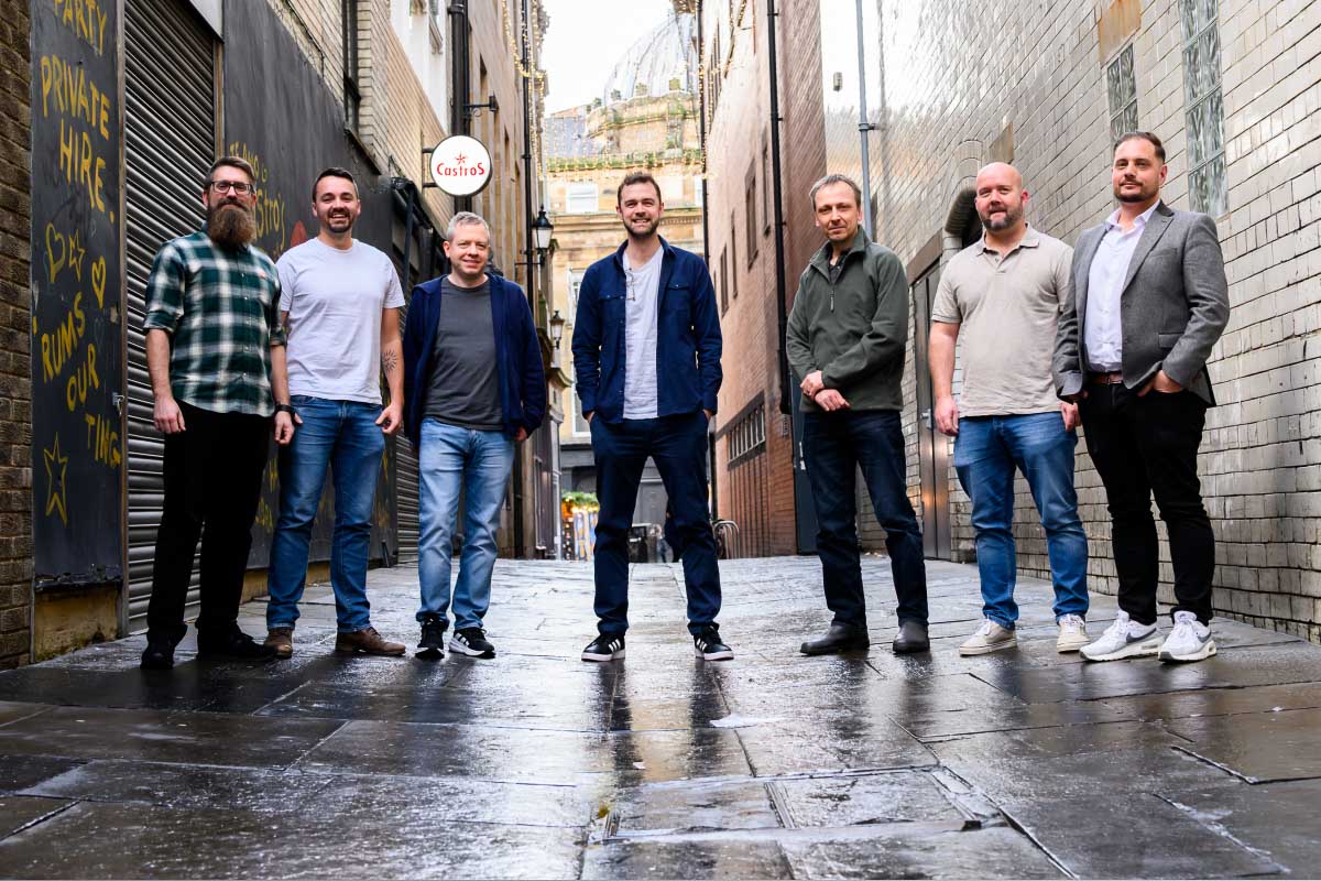 Members of Leighton's AWS Practice stood together, looking at the camera. 