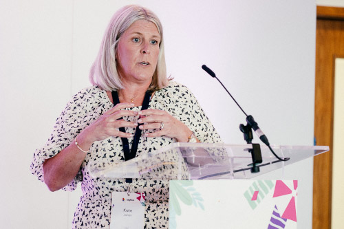 Leighton Account Director, Kate Jones, stood giving a talk. 