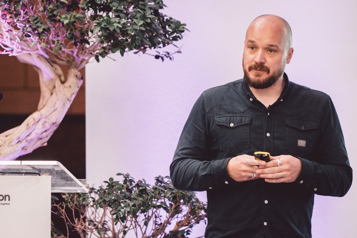 Leighton CTO, Steve Morland, on stage delivering a talk. 