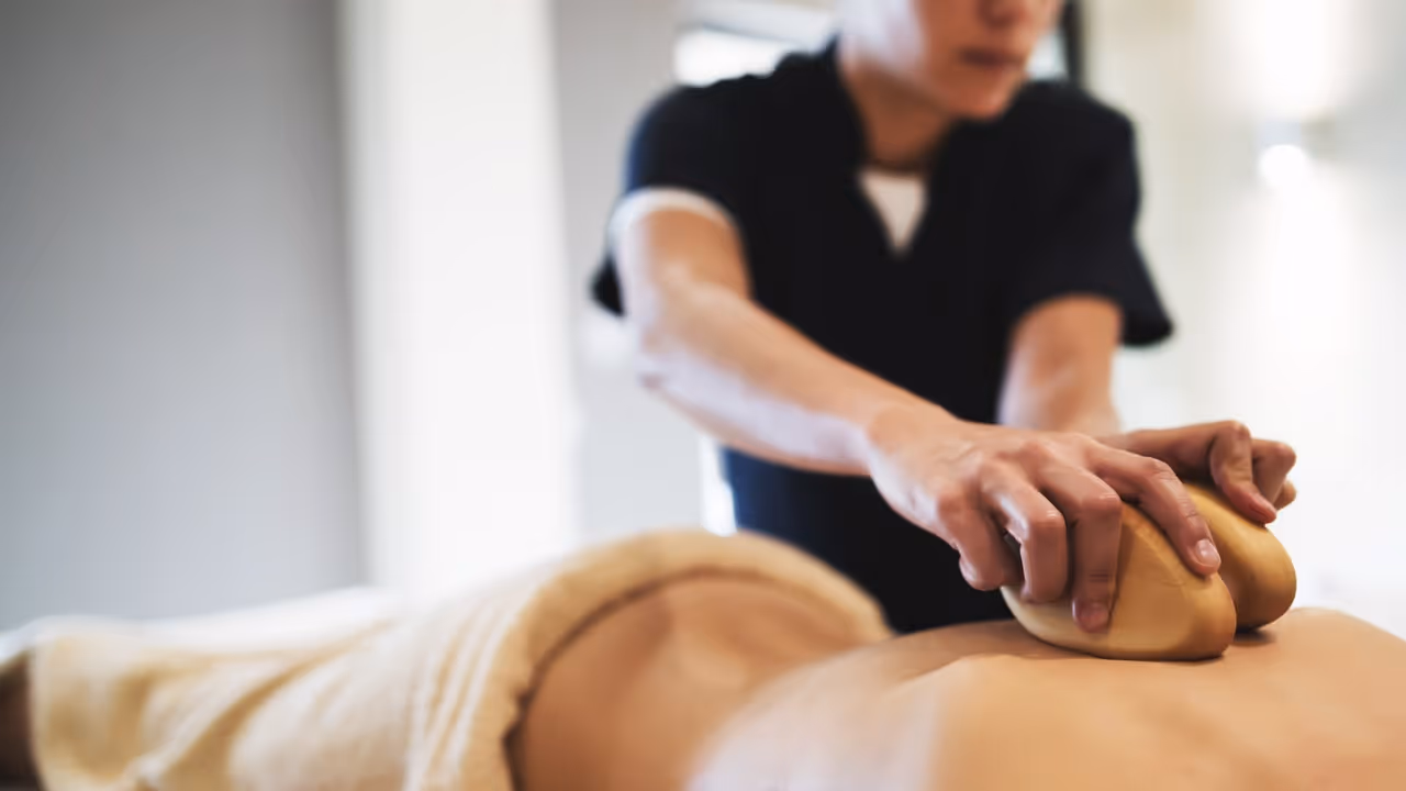 Guelph RMT applies pressure to clients back during massage