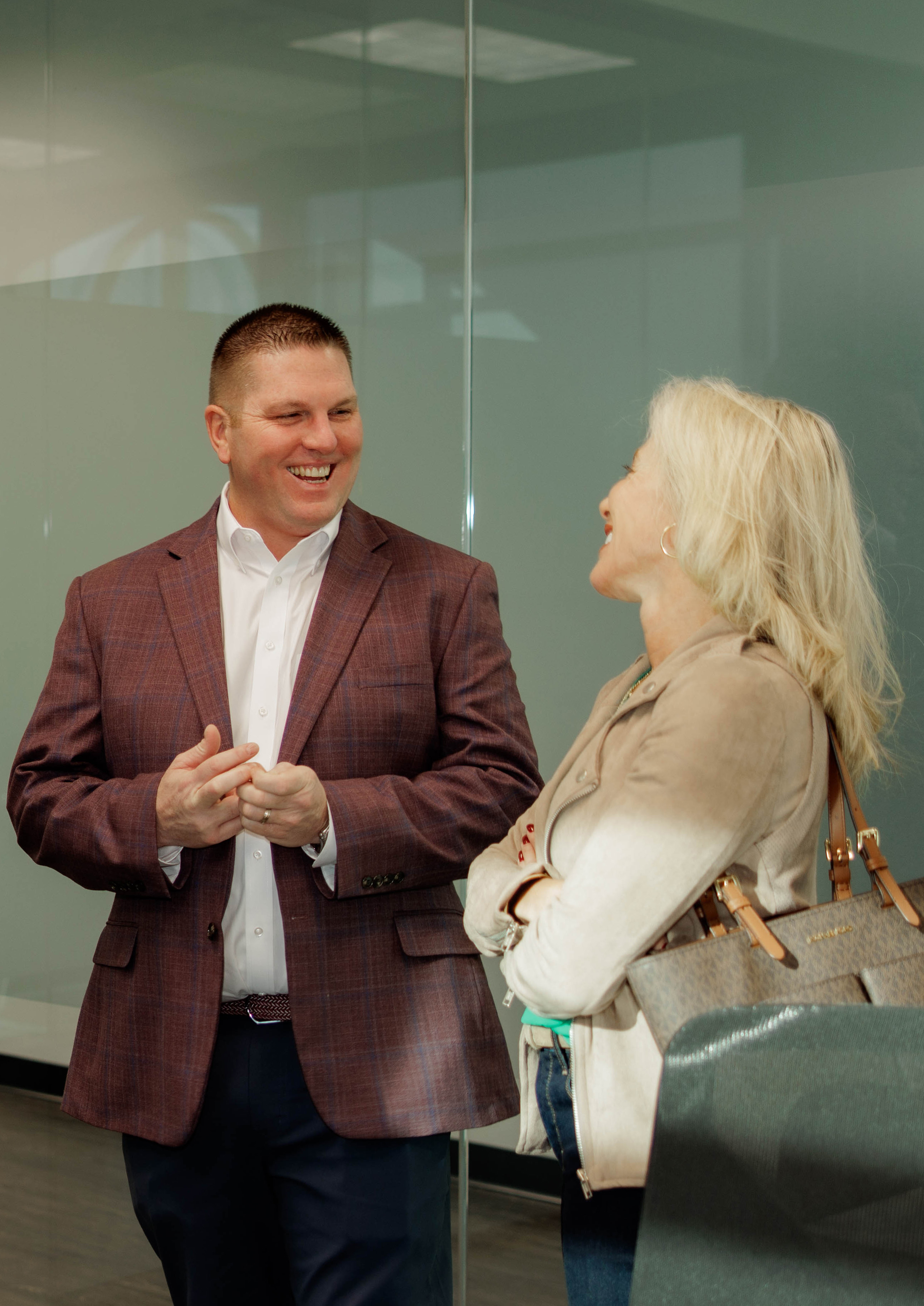 Baby and toddler laying on a bad