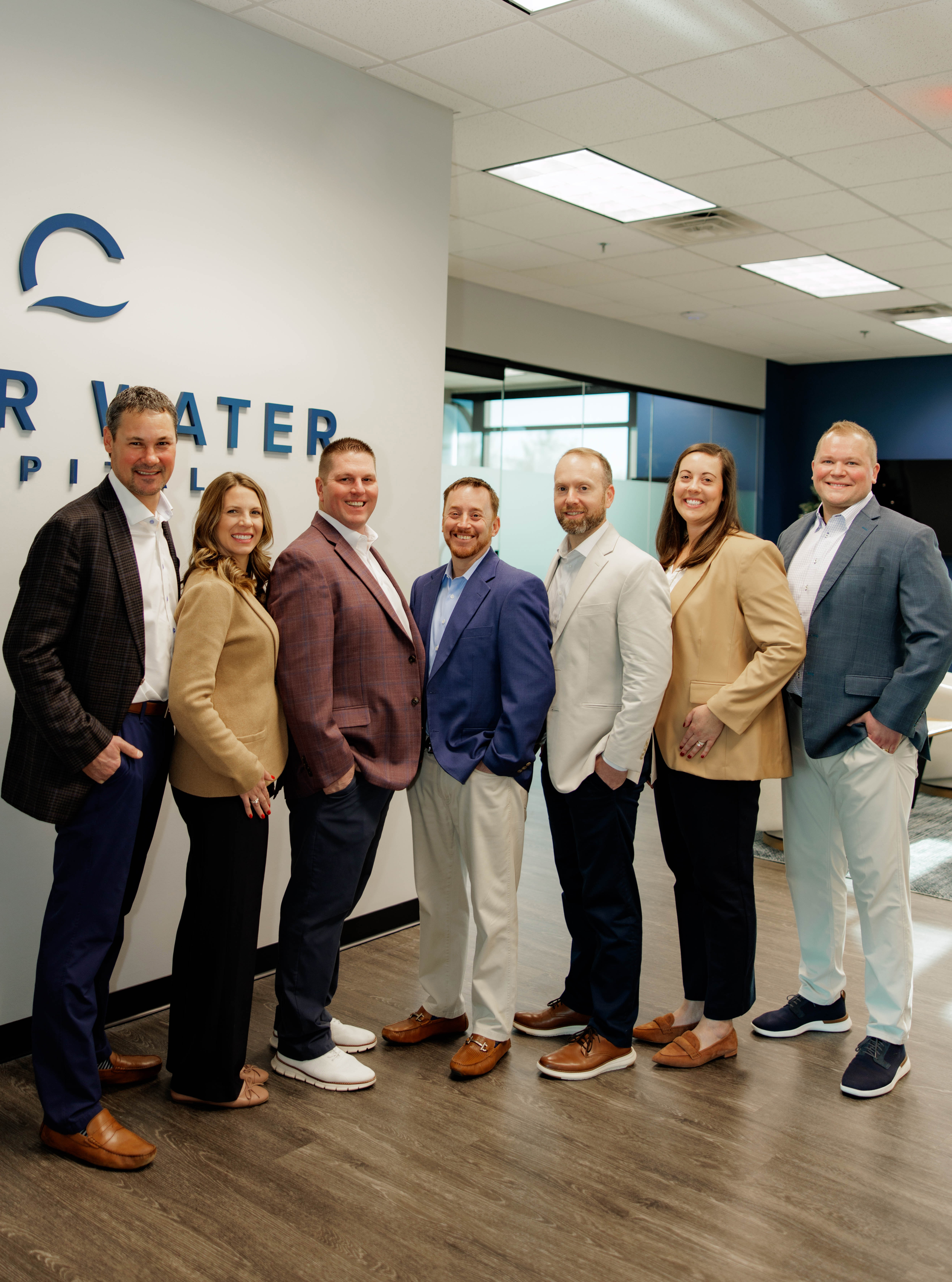 Man shaking hands in team meeting