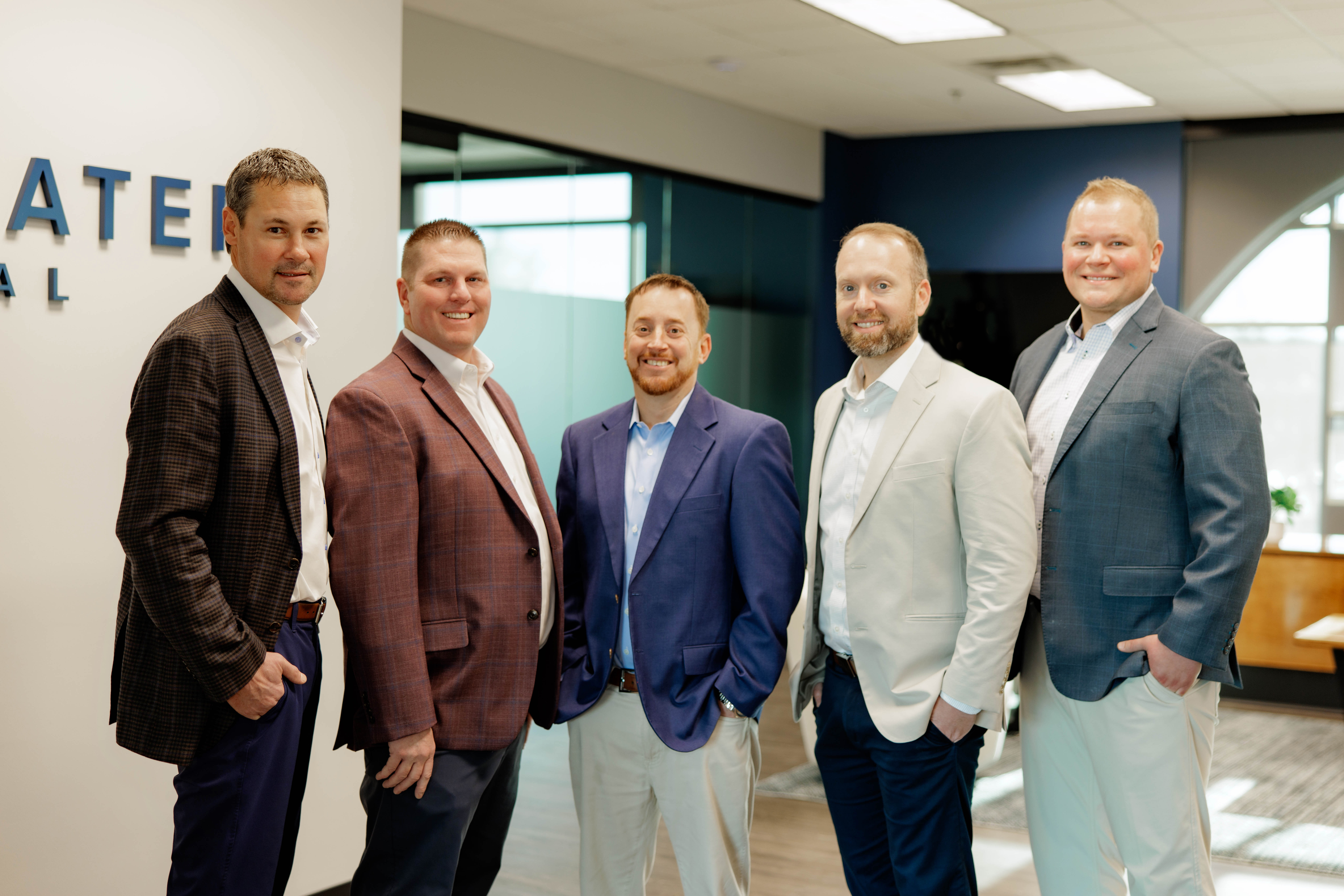 Team celebrating by joining hands