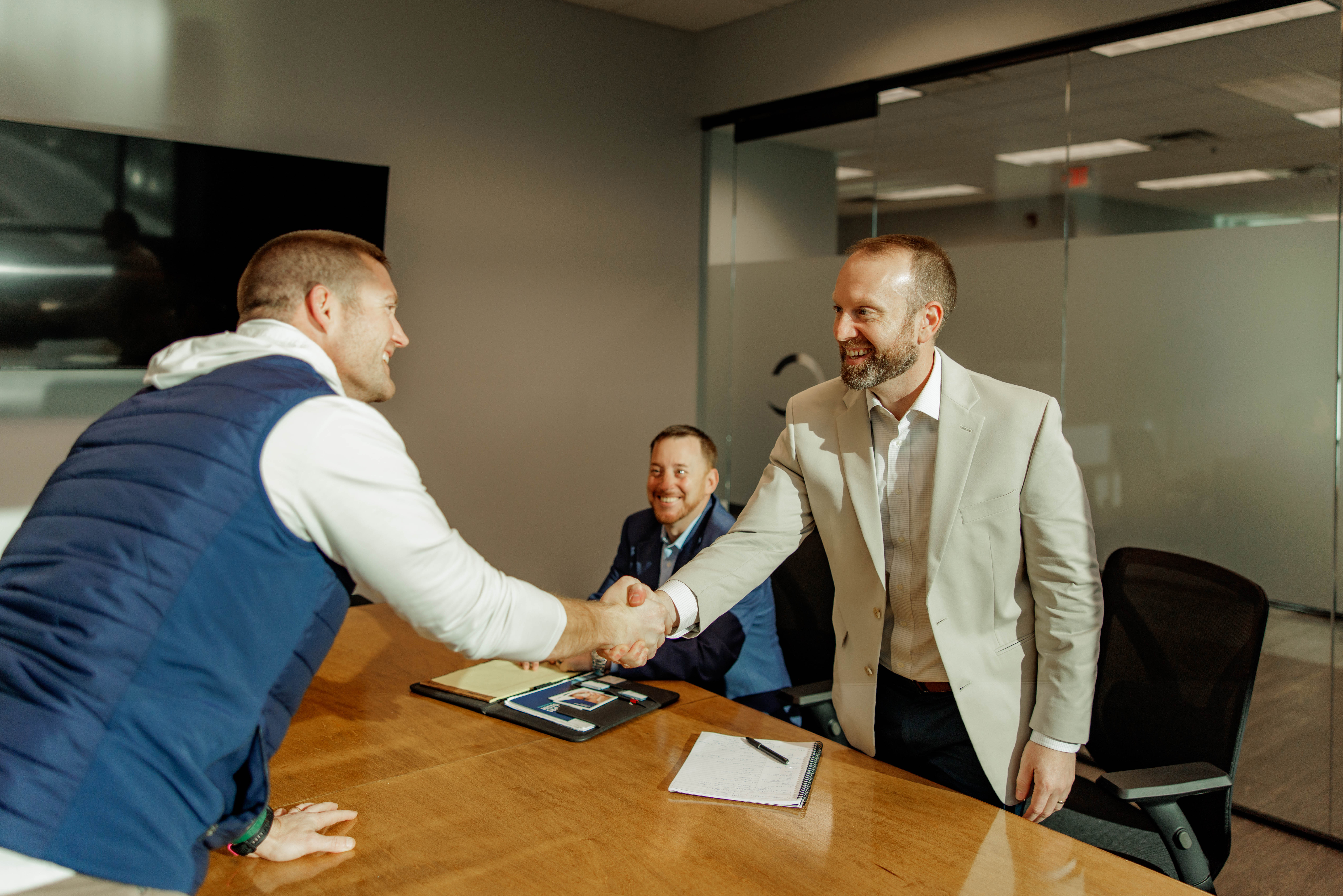 Team celebrating by joining hands