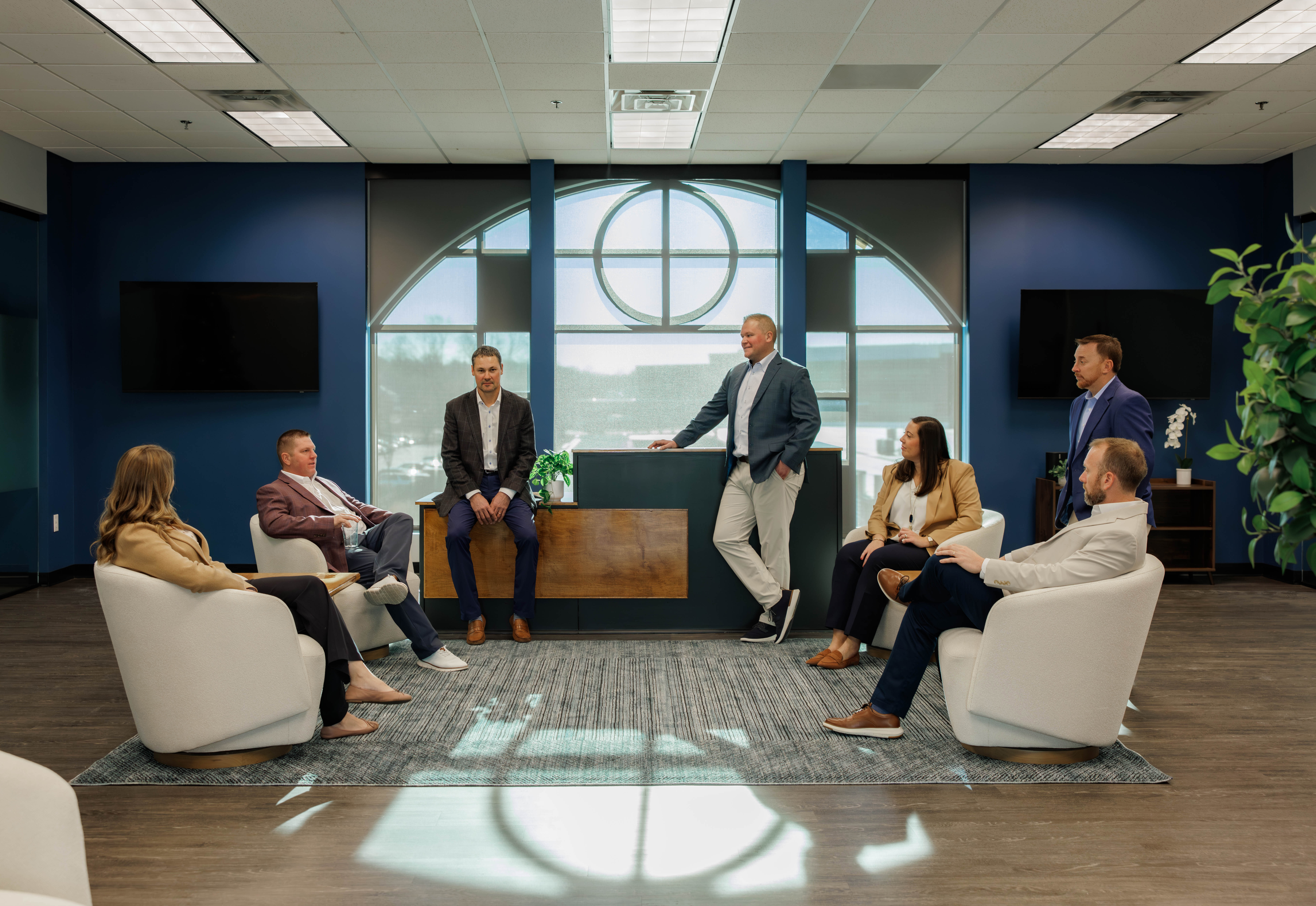 Team celebrating by joining hands