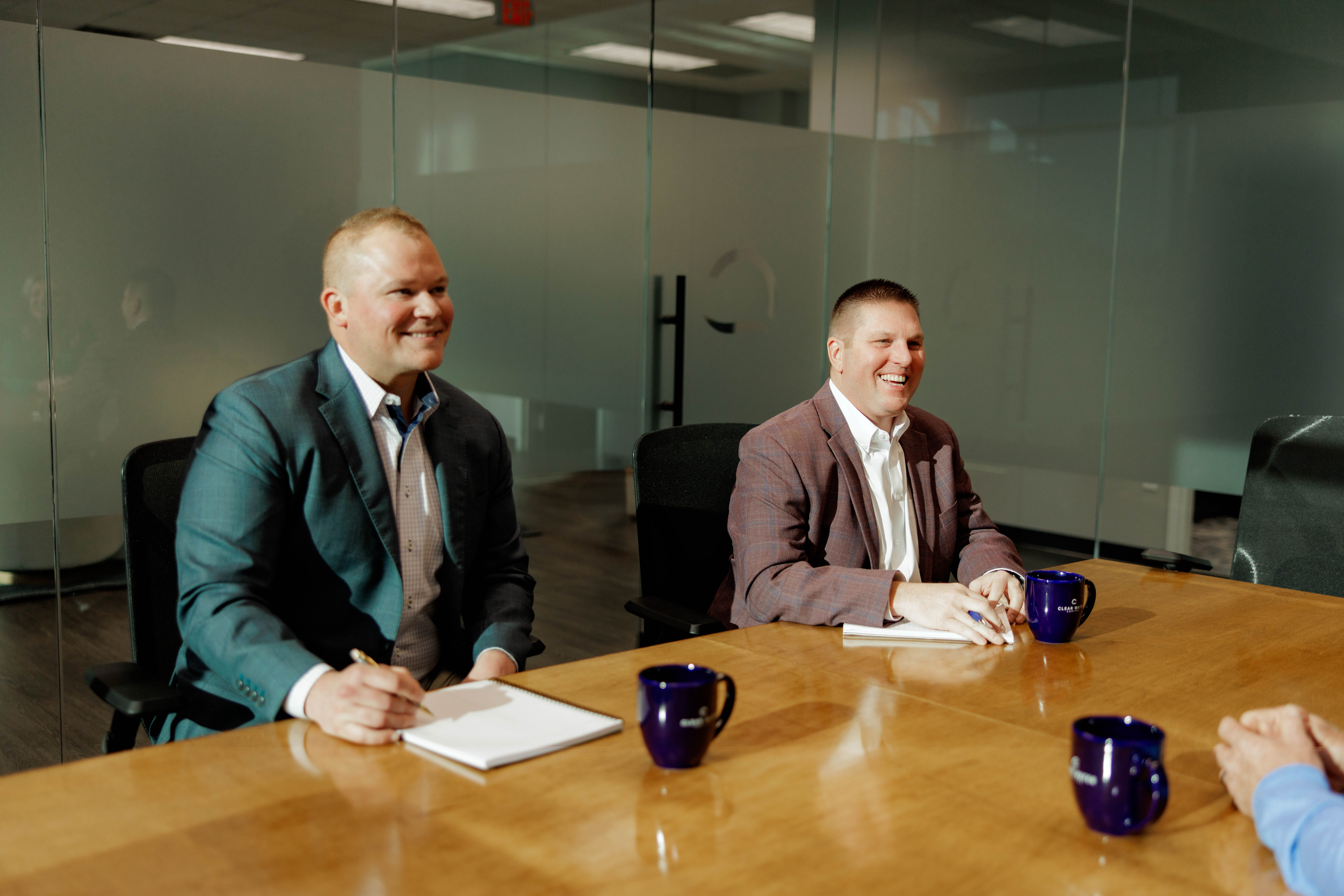 Man shaking hand in team meeting