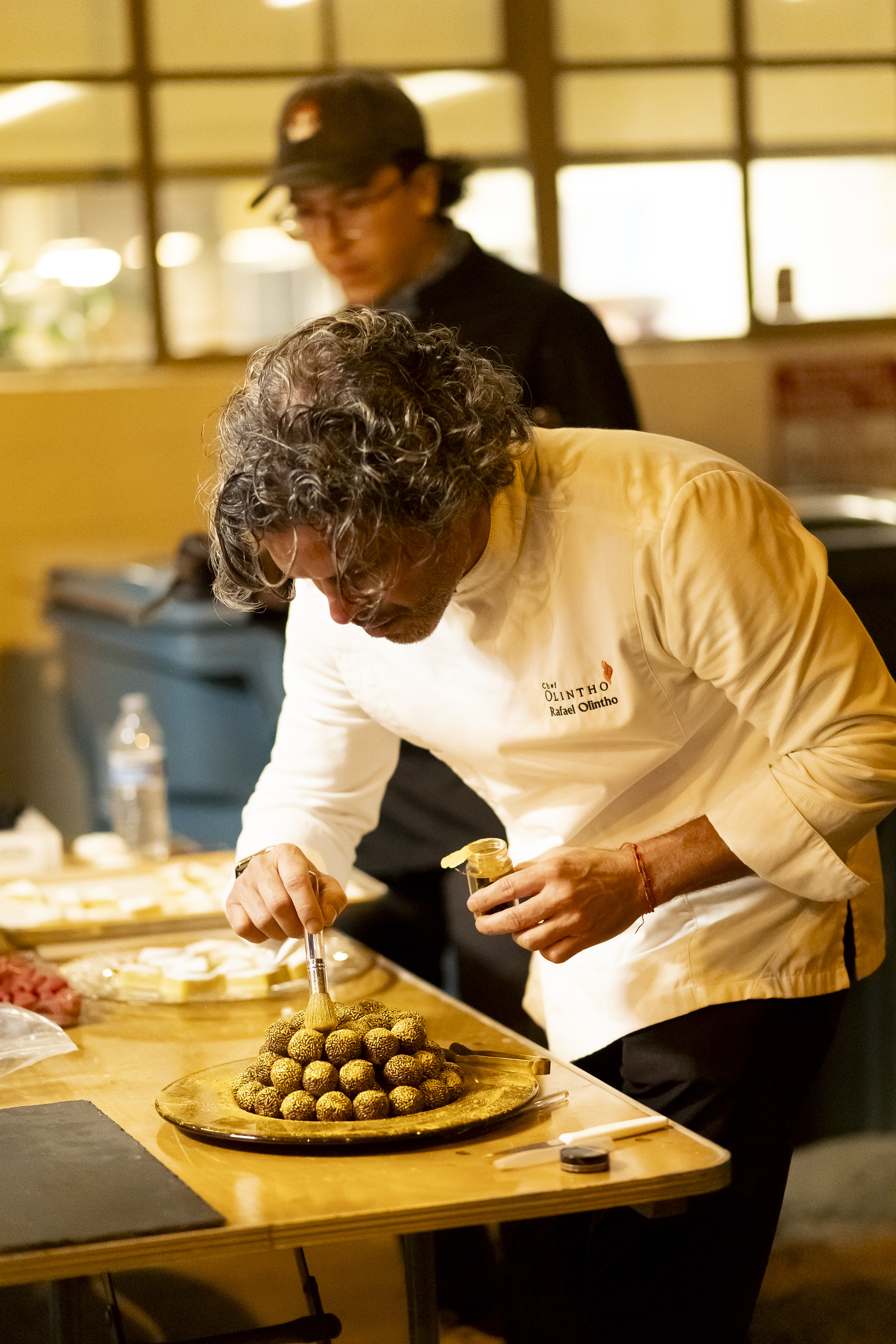 Personal chef Rafael Olintho preparing gourmet Brazilian desserts for private chef services in California.