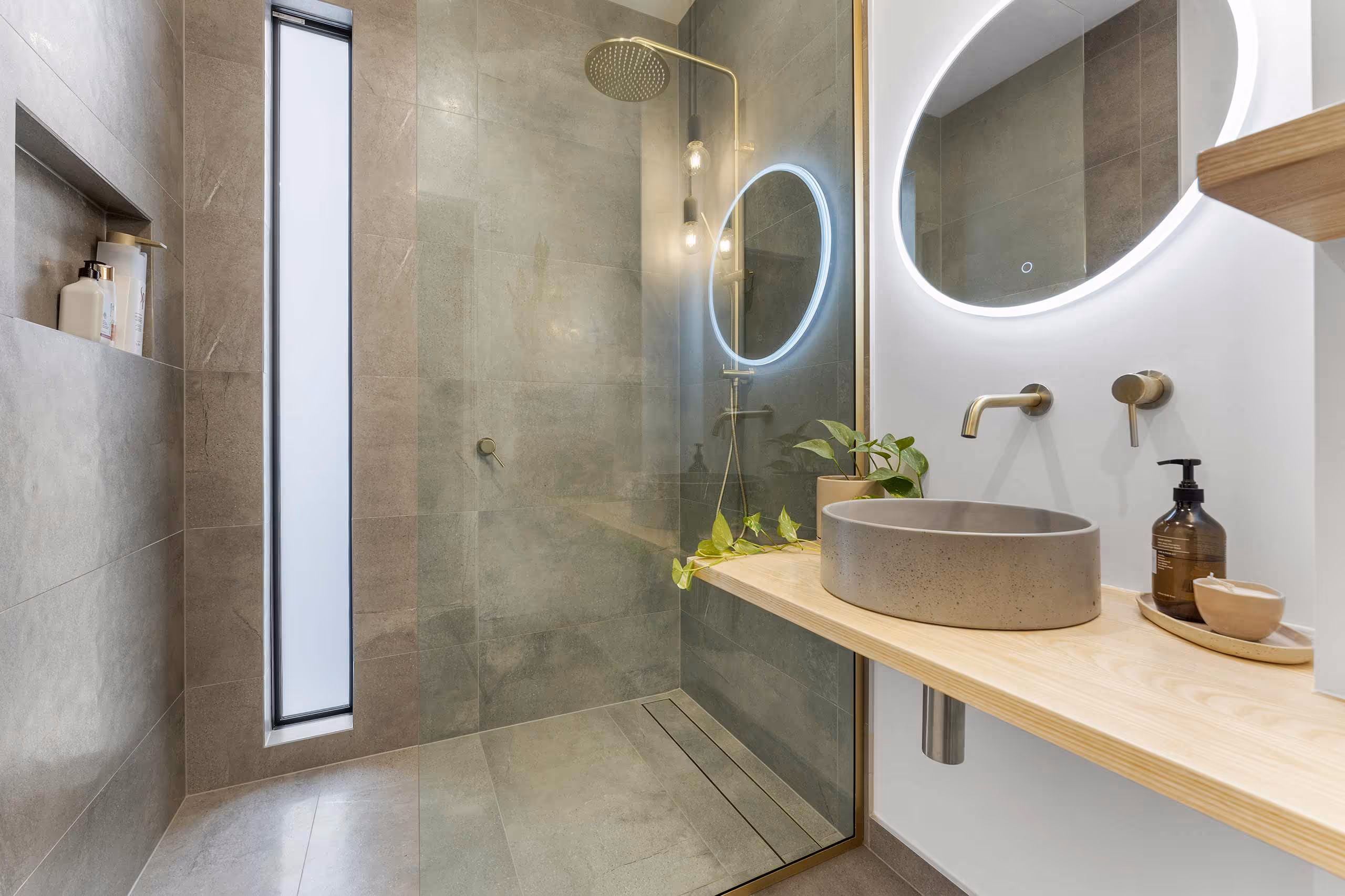 A fully tiled renovated home bathroom with tiles supplied by Concept Tile Collective in Whanganui