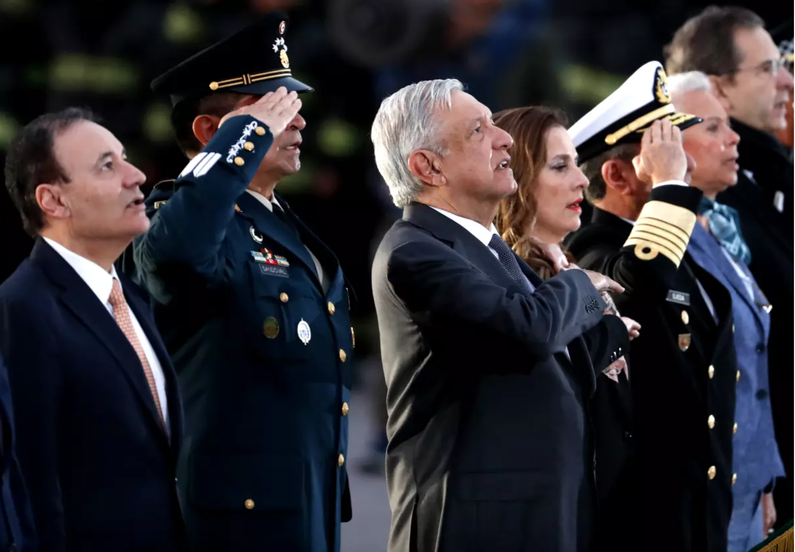 Alfonso Durazo, then Mexico’s security minister, left, with then President Andrés Manuel López Obrador, third from left, at a memorial ceremony in Mexico City in 2019. Now governor of Sonora, Durazo has had his visa revoked by U.S. officials. (Marco Ugarte / AP)