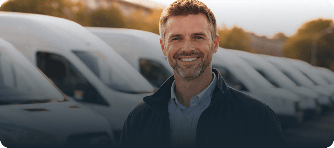 person stood in front of a line of vans
