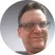 man_with_glassses_short_hair_selfie_smiling_grey_background_deeded_google_review_image