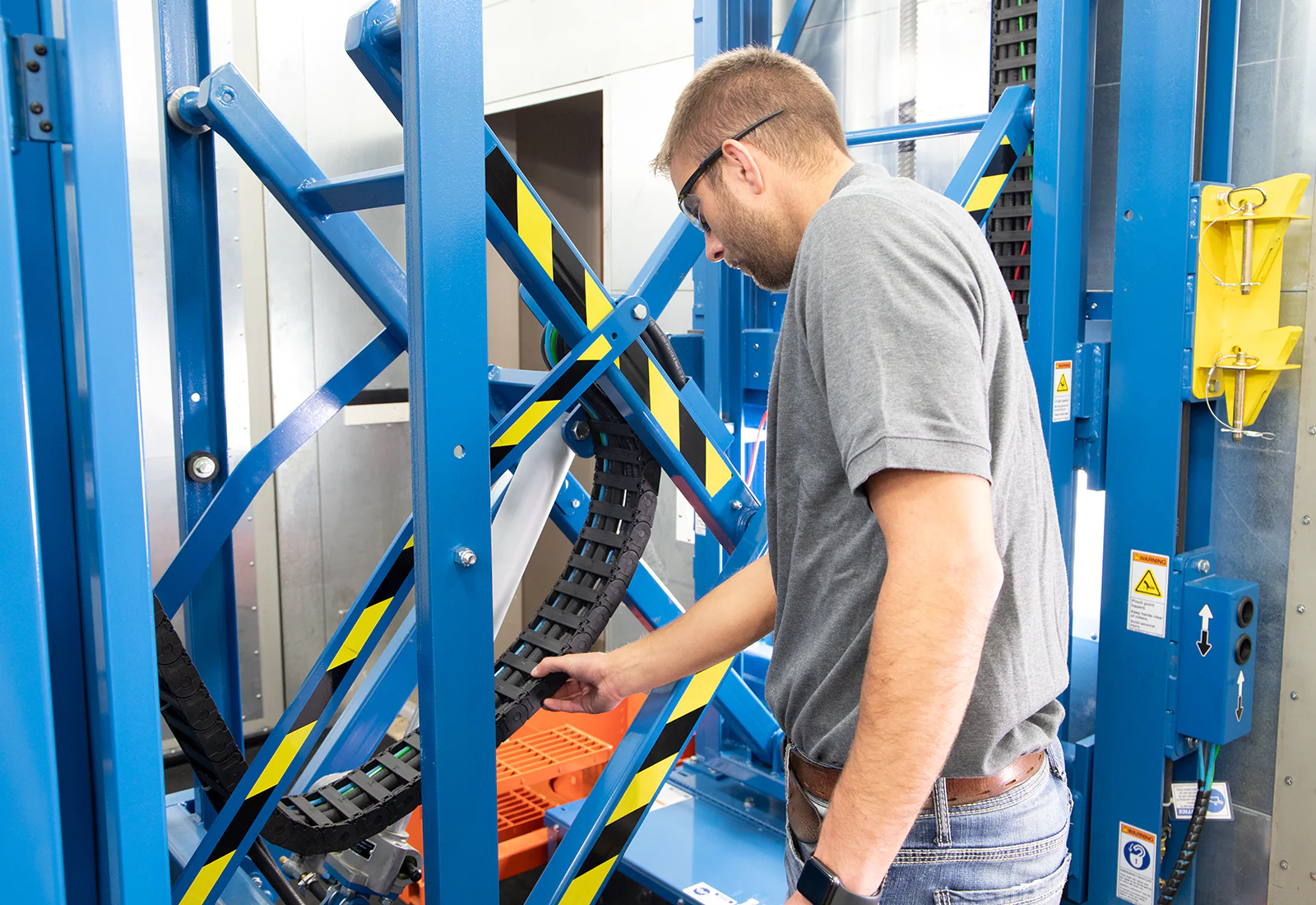 An LPI worker assembling metal.