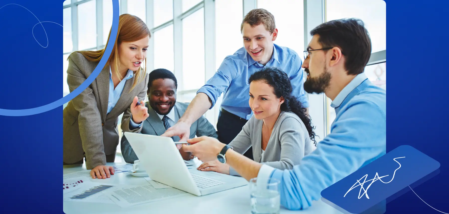 Team of professionals reviewing documents and collaborating around a laptop, representing trust and collaboration in digital signing workflows.