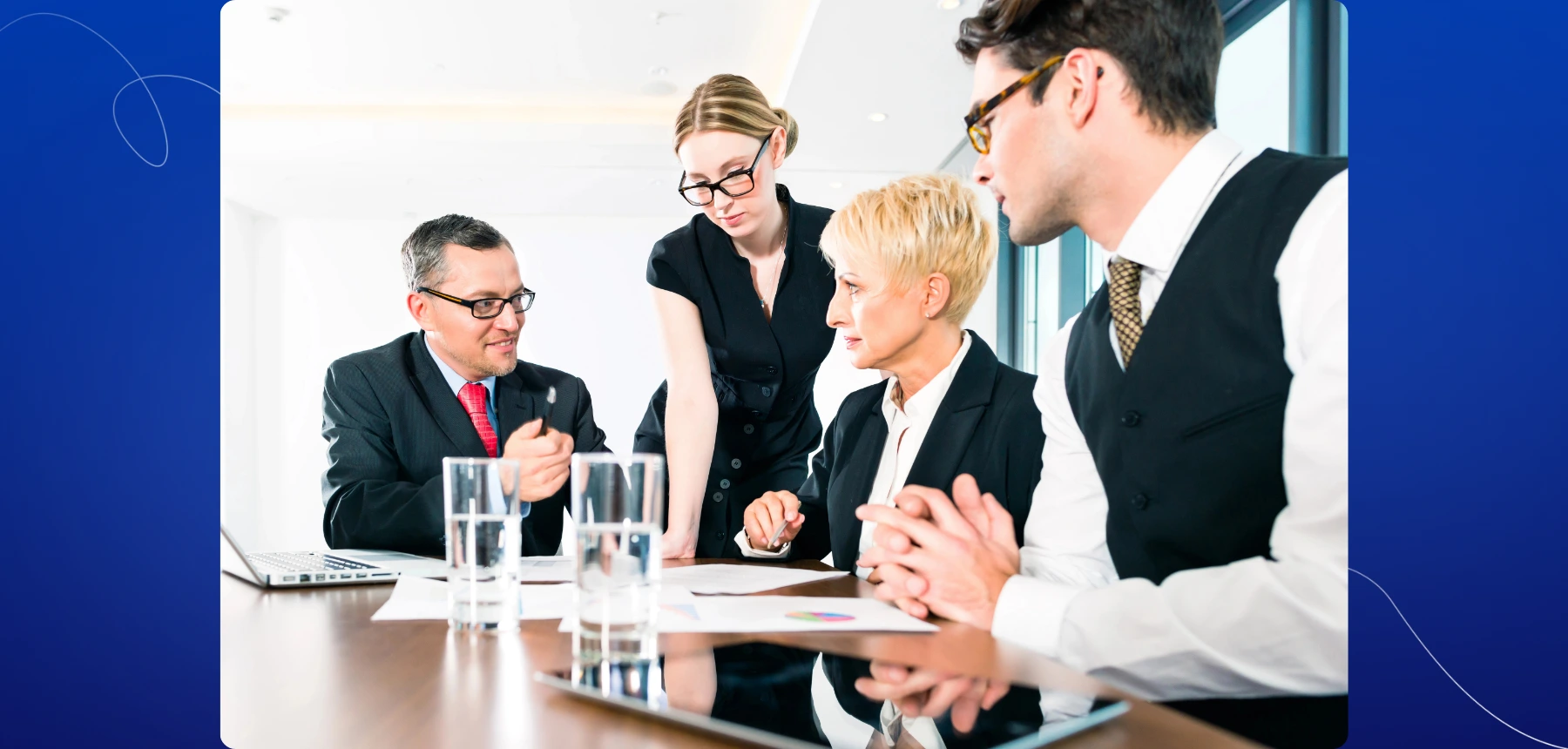Law firm professionals reviewing and signing legal documents together in a meeting room