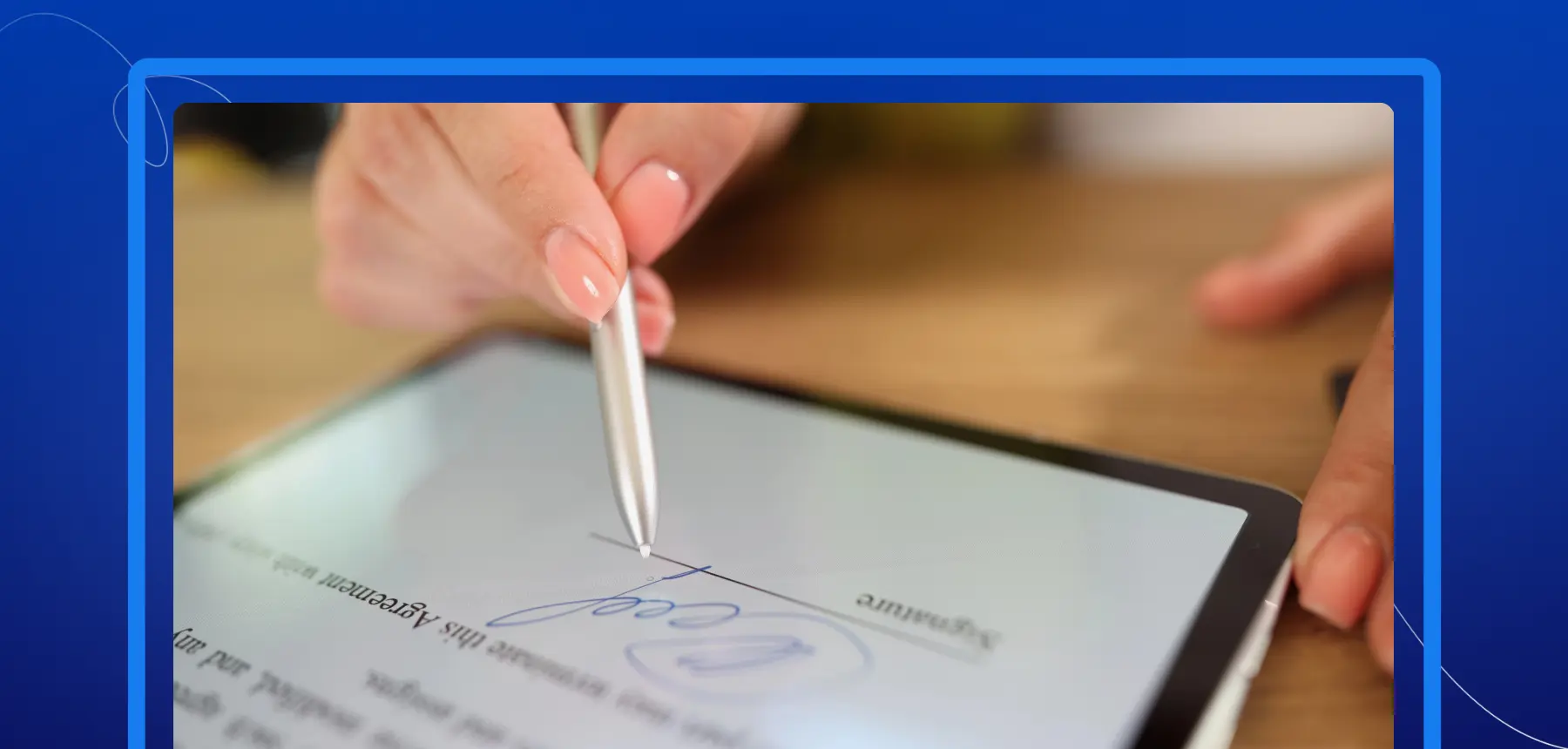 Person using a stylus to create a digital signature on a tablet for an electronic agreement.