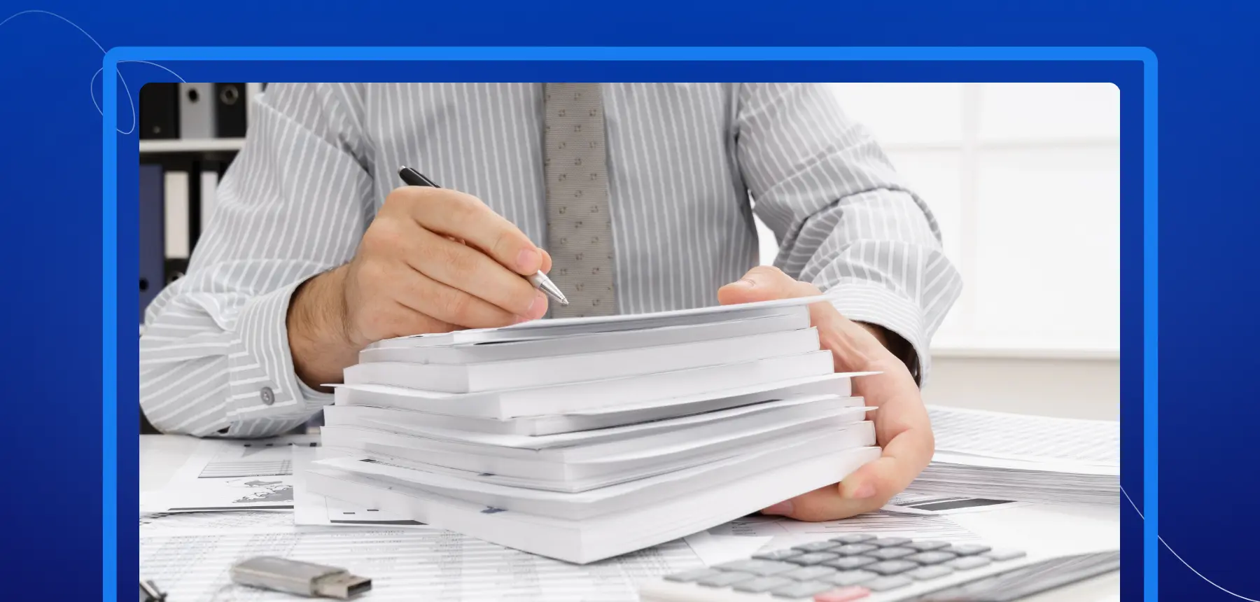 Person signing a large stack of paper documents at a desk, highlighting manual document processing and paperwork.
