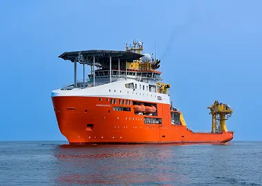 An offshore construction and support vessel on a sunny day
