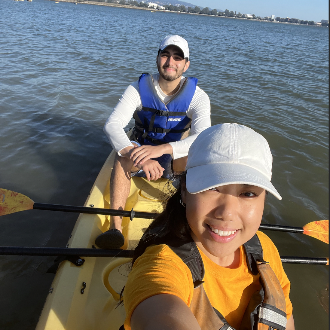 Lydia and man with beard kayaking.