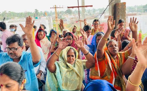 Indian people worshiping at church in rural village