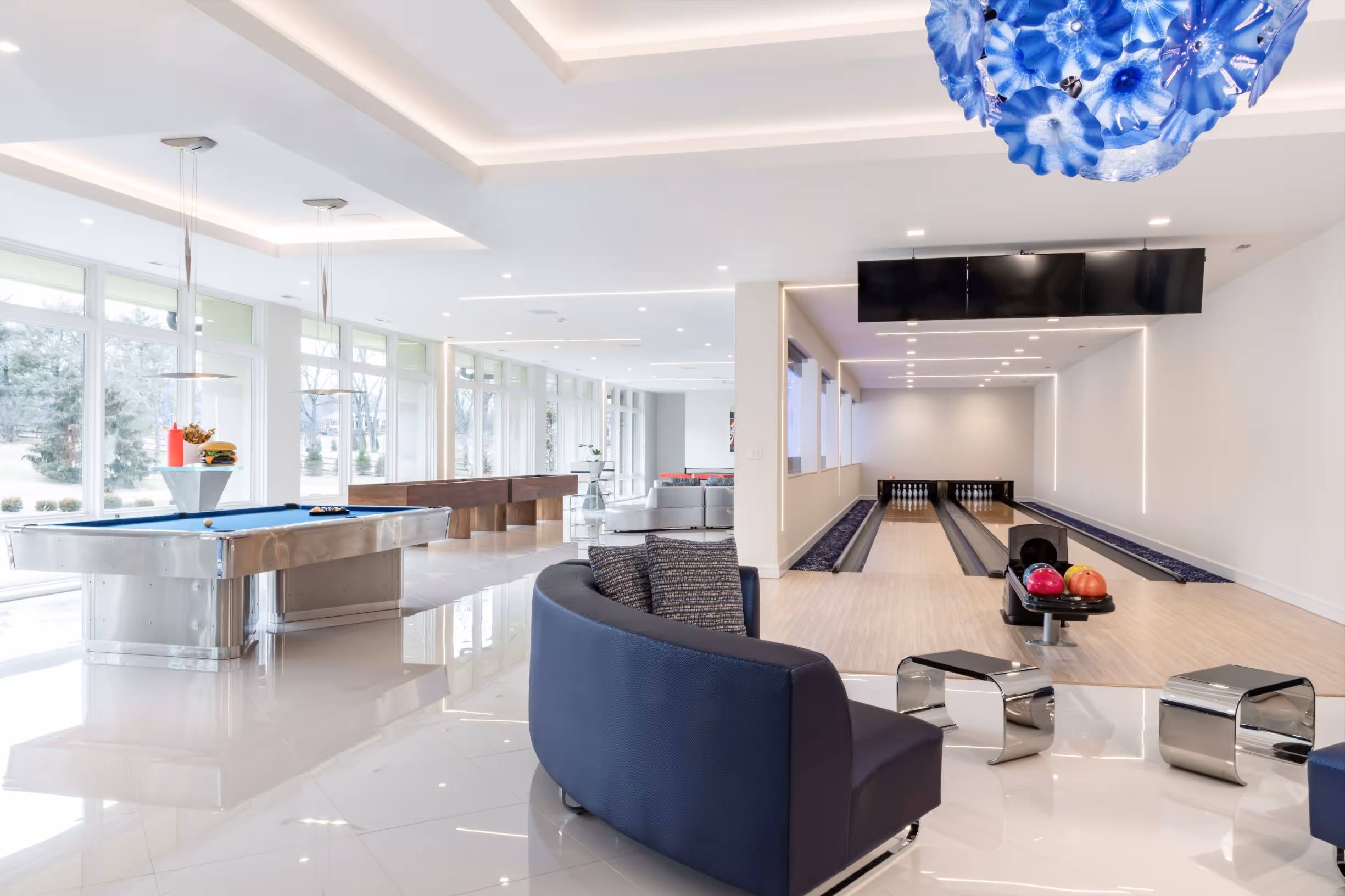 Integration controls smart home project. Basement bowling alley with media and lighting.