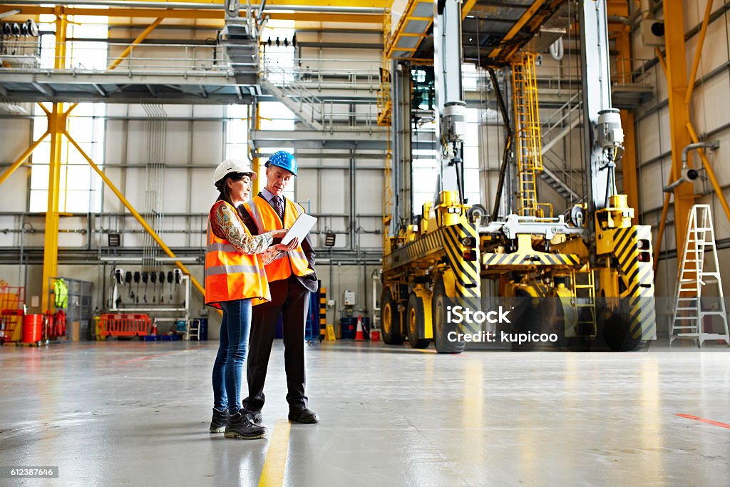 Technician in a mask smiles, breathing easy with GMG’s air quality standards