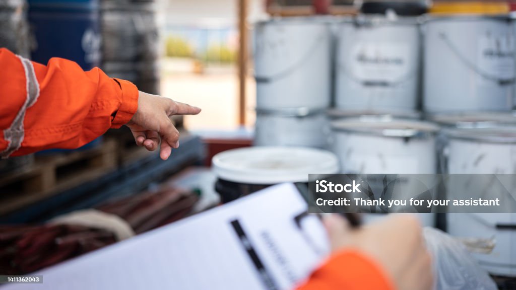Mechanic checks car undercarriage in GMG-compliant noise-controlled workshop