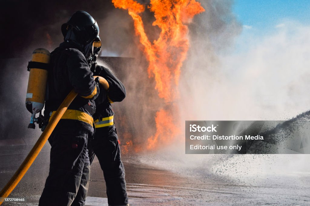 Technician in a mask smiles, breathing easy with GMG’s air quality standards