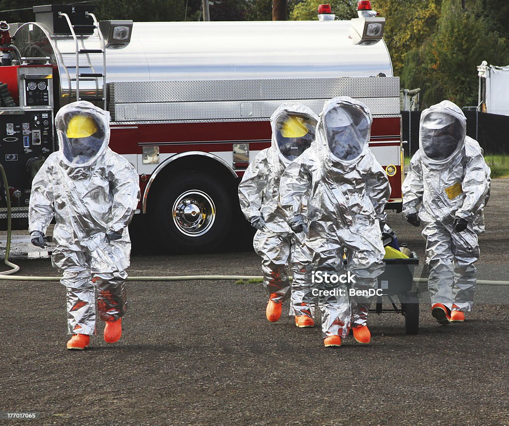 Technician in a mask smiles, breathing easy with GMG’s air quality standards