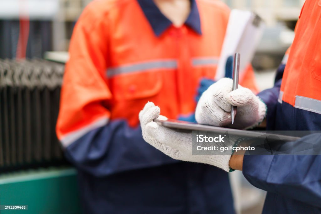 Technician in a mask smiles, breathing easy with GMG’s air quality standards